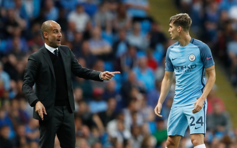 Football Soccer Britain - Manchester City v Steaua Bucharest - UEFA Champions League Qualifying Play-Off Second Leg - Etihad Stadium, Manchester, England - 24/8/16 Manchester City manager Pep Guardiola speaks to John Stones Action Images via Reuters / Carl Recine Livepic EDITORIAL USE ONLY.